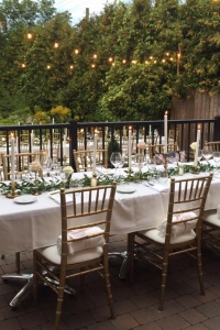 brass candle sticks on long table